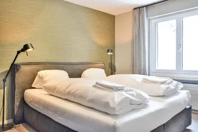 Ein Bett oder Betten in einem Zimmer der Unterkunft Hollandia 18