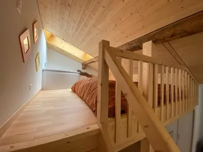Ein Bett oder Betten in einem Zimmer der Unterkunft Sunnu-Loft