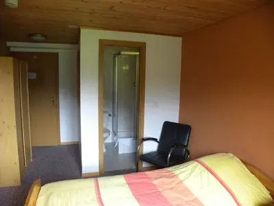 Ein Bett oder Betten in einem Zimmer der Unterkunft Hotel Restaurant Walliser Sonne