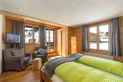 Ein Sitzbereich in der Unterkunft Hotel Des Alpes