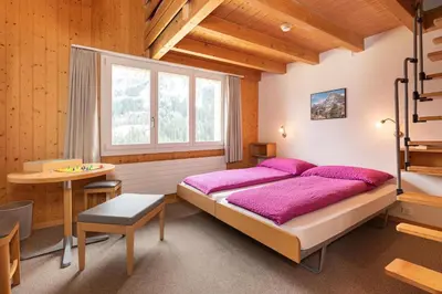 Ein Bett oder Betten in einem Zimmer der Unterkunft Hotel Alpenblick