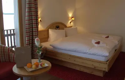 Ein Bett oder Betten in einem Zimmer der Unterkunft Hotel Caprice - Grindelwald