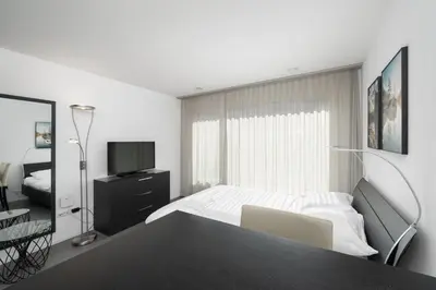 Ein Bett oder Betten in einem Zimmer der Unterkunft Studio JACKIE Interlaken