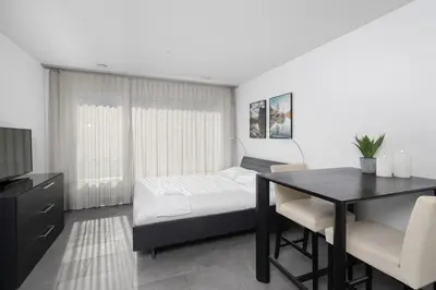 Ein Bett oder Betten in einem Zimmer der Unterkunft Studio NATASCHA Interlaken