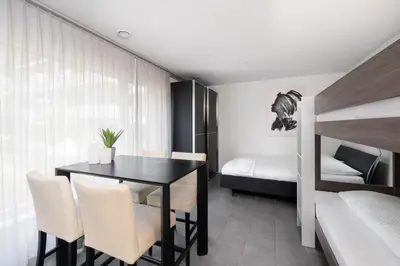 Ein Bett oder Betten in einem Zimmer der Unterkunft Studio RAFAEL Interlaken