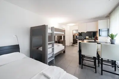 Ein Bett oder Betten in einem Zimmer der Unterkunft Studio VICTORIA Interlaken