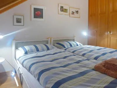 Ein Bett oder Betten in einem Zimmer der Unterkunft Apartment Les Vignettes 42 by Interhome