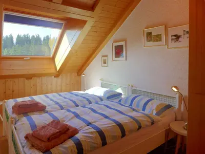 Ein Bett oder Betten in einem Zimmer der Unterkunft Apartment Les Vignettes 42 by Interhome