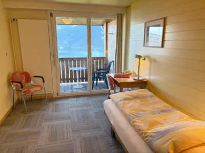 Ein Bett oder Betten in einem Zimmer der Unterkunft Hotel Sunnehüsi