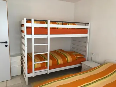 Ein Bett oder Betten in einem Zimmer der Unterkunft Appartamento da 2 locali a Bosco Gurin