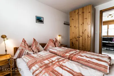 Ein Bett oder Betten in einem Zimmer der Unterkunft Haus Lotus, Riederalp Moosfluhbahn