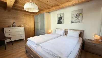 Ein Bett oder Betten in einem Zimmer der Unterkunft Bergquelle 1.OG Ost