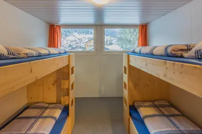 Ein Bett oder Betten in einem Zimmer der Unterkunft Mountain Lodge Backpackercamp