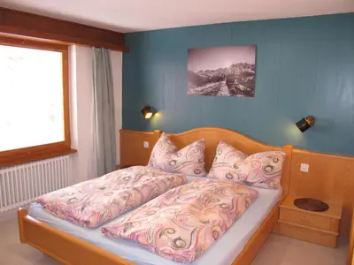 Ein Bett oder Betten in einem Zimmer der Unterkunft Appartementhaus Venetz SAAS107