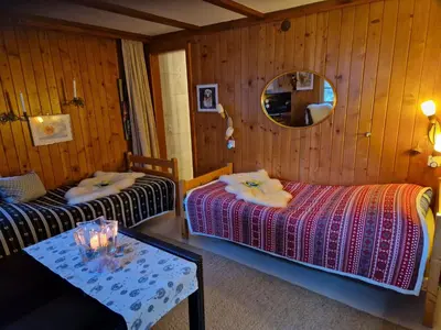 Ein Bett oder Betten in einem Zimmer der Unterkunft Chalet Gotthelf Gartenstudio, Ferien mit Hund