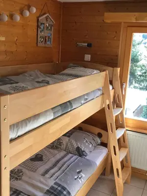 Ein Bett oder Betten in einem Zimmer der Unterkunft La gentiane