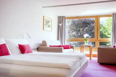 Ein Bett oder Betten in einem Zimmer der Unterkunft Hotel Kreuz Lenk