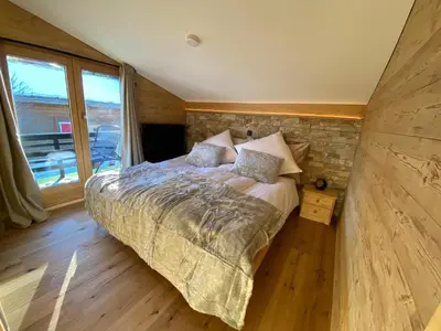 Ein Bett oder Betten in einem Zimmer der Unterkunft Chalet TALBLICK - Luxurious Penthouse on the 1st floor!