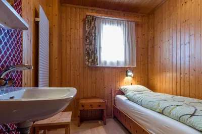 Ein Bett oder Betten in einem Zimmer der Unterkunft Chalet Sunnegga