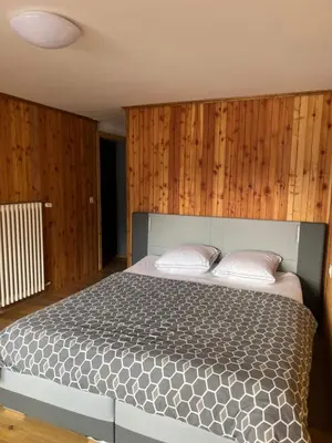 Ein Bett oder Betten in einem Zimmer der Unterkunft Romantica Grächen