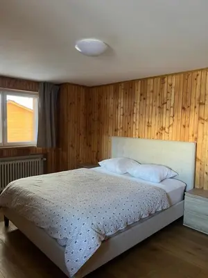 Ein Bett oder Betten in einem Zimmer der Unterkunft Romantica Grächen