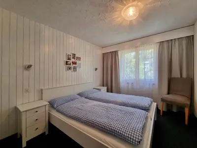 Ein Bett oder Betten in einem Zimmer der Unterkunft Alpengarten 1. OG