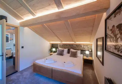 Ein Bett oder Betten in einem Zimmer der Unterkunft Chalet Margaux Penthouse