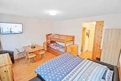 Ein Bett oder Betten in einem Zimmer der Unterkunft Studio cosy au centre de Crans-Montana (1-4 personnes)