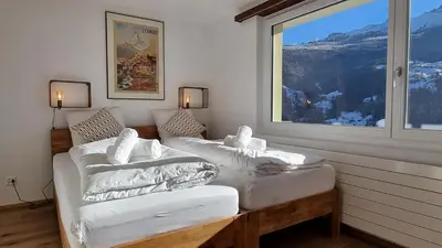 Ein Bett oder Betten in einem Zimmer der Unterkunft Mattertal Lodge