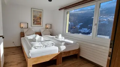 Ein Bett oder Betten in einem Zimmer der Unterkunft Mattertal Lodge