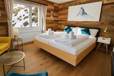 Ein Bett oder Betten in einem Zimmer der Unterkunft Mattertal Lodge