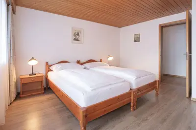 Ein Bett oder Betten in einem Zimmer der Unterkunft Apartment Jungfrau Lodge