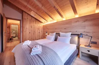 Ein Bett oder Betten in einem Zimmer der Unterkunft Attico Grindelwald