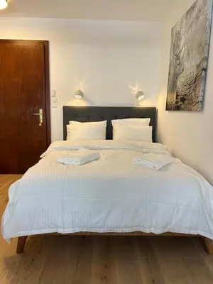 Ein Bett oder Betten in einem Zimmer der Unterkunft La Perle Montana