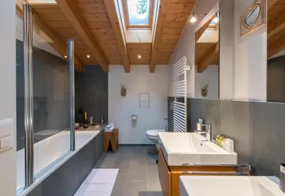 Ein Badezimmer in der Unterkunft Waldbort Penthouse