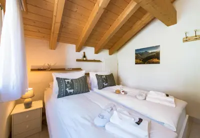 Ein Bett oder Betten in einem Zimmer der Unterkunft Chalet Rose Penthouse Residence