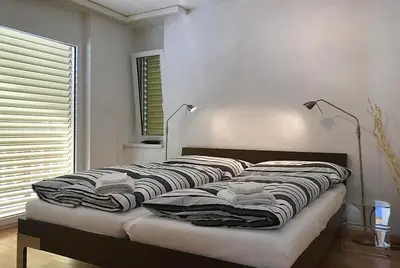 Ein Bett oder Betten in einem Zimmer der Unterkunft Residenz Ambassador