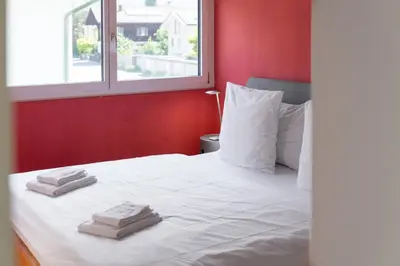 Ein Bett oder Betten in einem Zimmer der Unterkunft Urban Cube mit Sauna