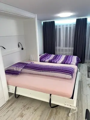 Ein Bett oder Betten in einem Zimmer der Unterkunft Holiday 88