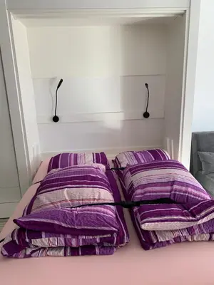 Ein Bett oder Betten in einem Zimmer der Unterkunft Holiday 88