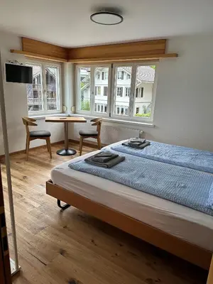 Ein Bett oder Betten in einem Zimmer der Unterkunft Hotel WALZ