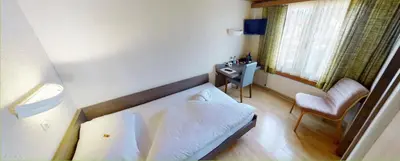 Ein Bett oder Betten in einem Zimmer der Unterkunft Boutique Hotel & Restaurant Bären Ringgenberg