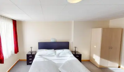 Ein Bett oder Betten in einem Zimmer der Unterkunft Boutique Hotel & Restaurant Bären Ringgenberg