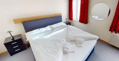 Ein Bett oder Betten in einem Zimmer der Unterkunft Boutique Hotel & Restaurant Bären Ringgenberg
