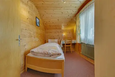 Ein Bett oder Betten in einem Zimmer der Unterkunft Anemone