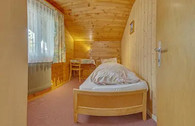 Ein Bett oder Betten in einem Zimmer der Unterkunft Anemone