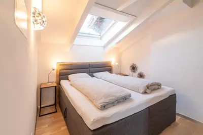 Ein Bett oder Betten in einem Zimmer der Unterkunft Haus La Rocca by Zermatt Premium Apartments