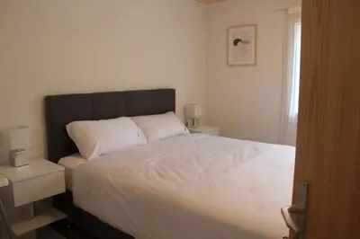 Ein Bett oder Betten in einem Zimmer der Unterkunft Mountain Oasis Apartment Kandersteg-Adelboden