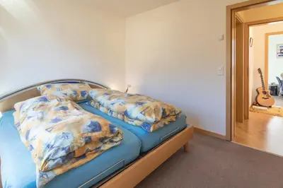 Ein Bett oder Betten in einem Zimmer der Unterkunft Chalet Hannegg 2