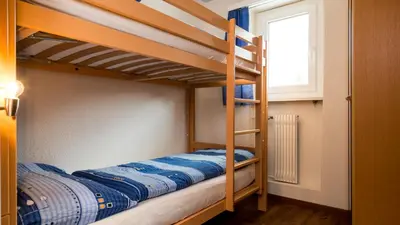 Ein Bett oder Betten in einem Zimmer der Unterkunft Haus Aristella